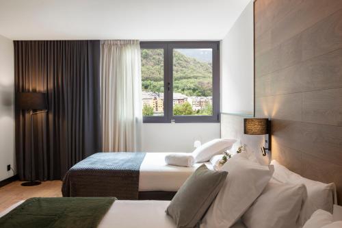 Habitación Triple del hotel Acta Arthotel. Foto 2