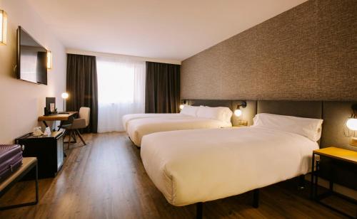 Habitación Triple del hotel Yomo Centric. Foto 1