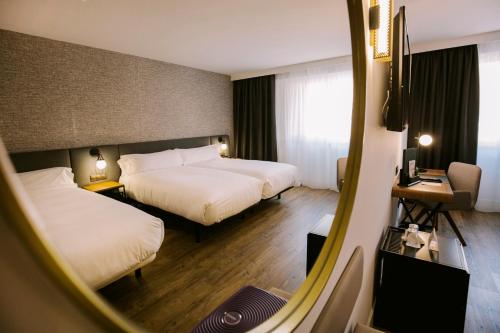 Habitación Triple del hotel Yomo Centric. Foto 4