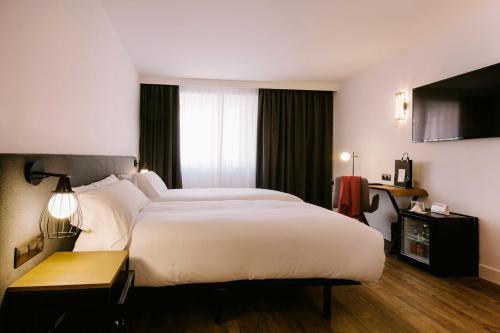 Habitación Familiar Doble - 2 camas del hotel Yomo Centric. Foto 1