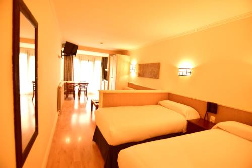 Habitación doble Comunicada 2 Camas dobles del hotel Yomo Patagonia. Foto 3