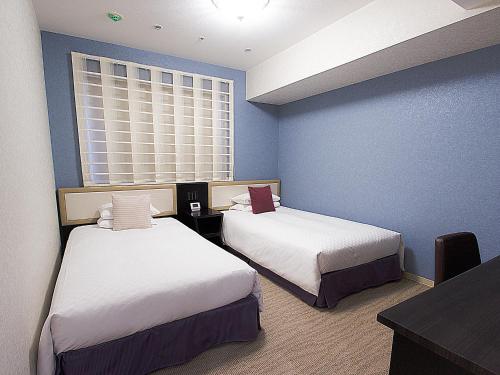 Habitación Esquinera con 2 camas individuales - No Fumadores del hotel Hearton Kitaumeda. Foto 2