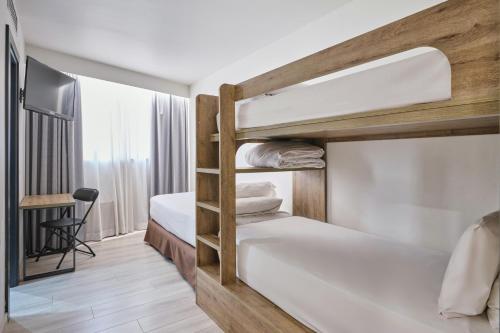 Habitación Familiar Deluxe del hotel Exe Prisma. Foto 11