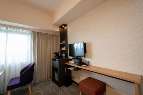 Habitación Doble con 2 camas individuales y 1 cama supletoria - No fumadores del hotel Kanazawa. Foto 1