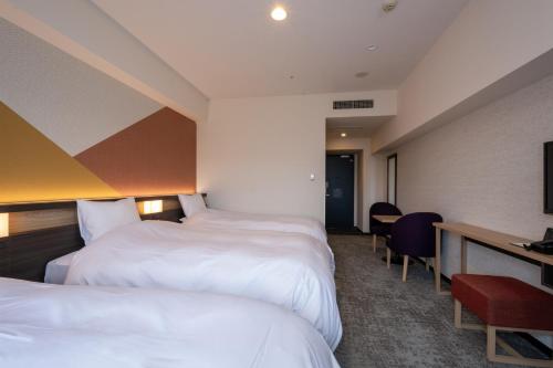 Habitación Doble para fumadores con cama supletoria - 2 camas del hotel Kanazawa. Foto 3