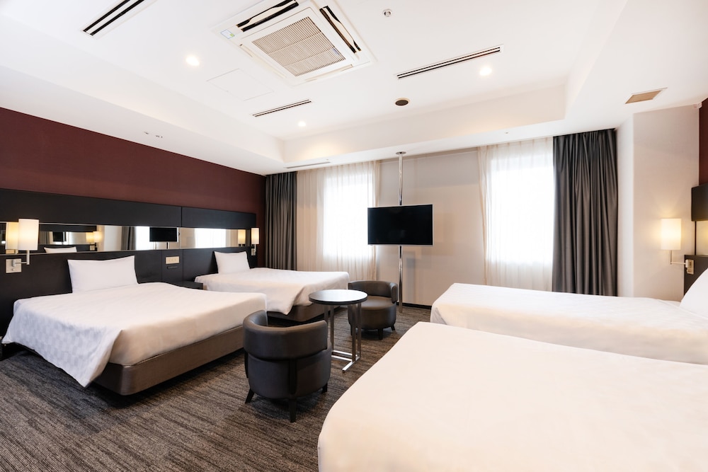 Habitación Cuádruple Deluxe del hotel The OneFive Osaka Namba Dotonbori. Foto 1