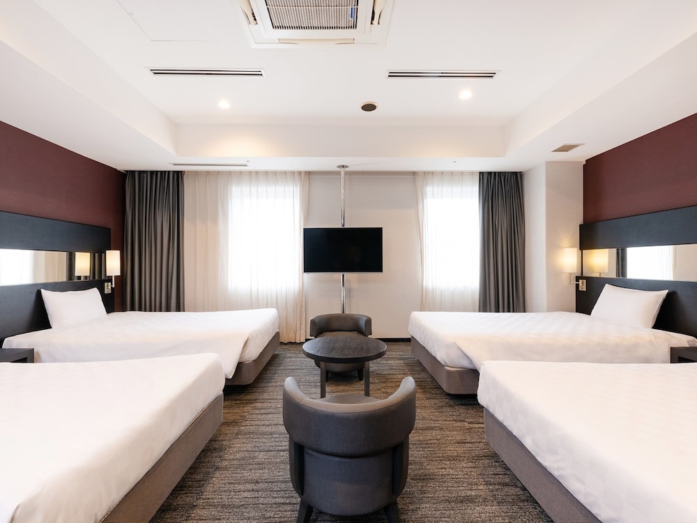 Habitación Cuádruple Deluxe del hotel The OneFive Osaka Namba Dotonbori. Foto 3