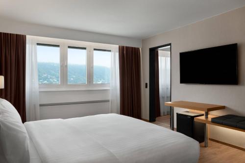 Suite de 1 dormitorio con cama extragrande y vistas a la montaña - Planta alta del hotel Ac Hotel Innsbruck. Foto 1