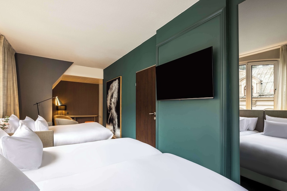 Habitación familiar (2Adults + 2Children) del hotel NH Collection Salzburg City. Foto 14