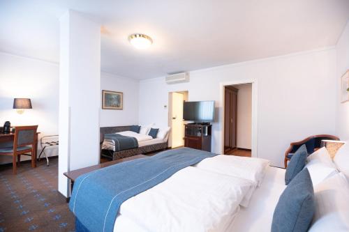 Habitación familiar Premium con cama extragrande y sofá cama del hotel Garner Vienna - Prinz Eugen by IHG. Foto 2