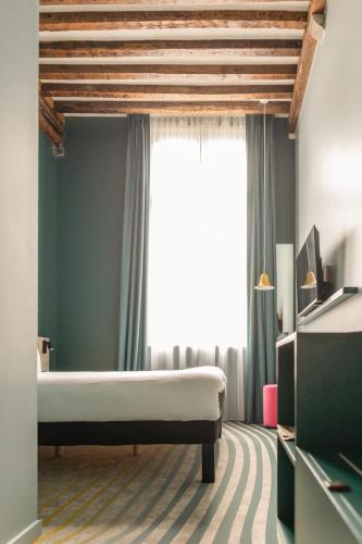 Habitación Doble Premium del hotel ibis Styles Brugge Centrum. Foto 9