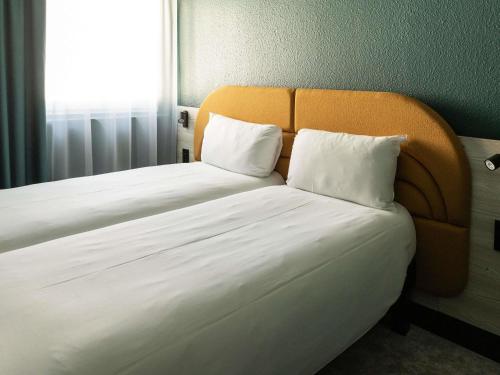 Habitación Estándar - 2 camas individuales del hotel ibis Styles Brugge Centrum. Foto 13