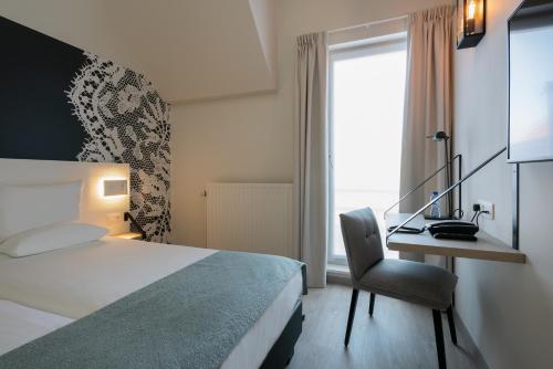 Habitación Doble con bañera del hotel Martin's Brugge. Foto 4