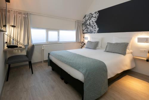 Habitación Confort Doble con bañera del hotel Martin's Brugge. Foto 1