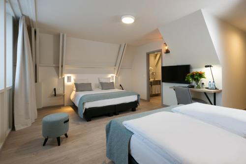 Habitación cuádruple del hotel Martin's Brugge. Foto 1