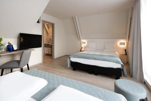 Habitación cuádruple del hotel Martin's Brugge. Foto 2