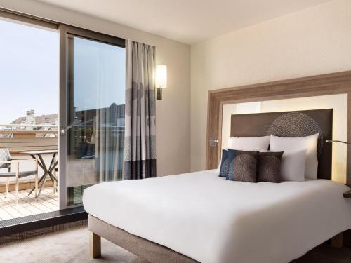 Habitación Doble Executive con balcón del hotel Novotel Geneve Centre
