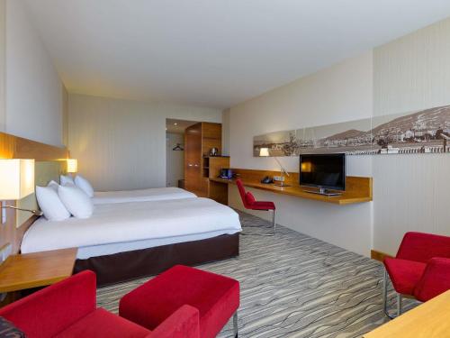 Habitación Doble Deluxe - 2 camas del hotel Mövenpick Hotel Geneva. Foto 4