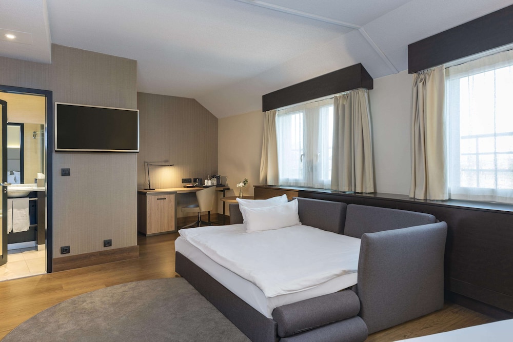 Habitación familiar del hotel Nh Geneva Airport. Foto 3