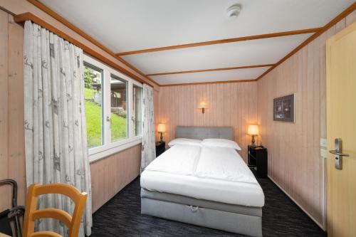 Small Double Room with Private Bathroom (no view) del hotel Jungfrau Lodge Swiss Mountain. Foto 8