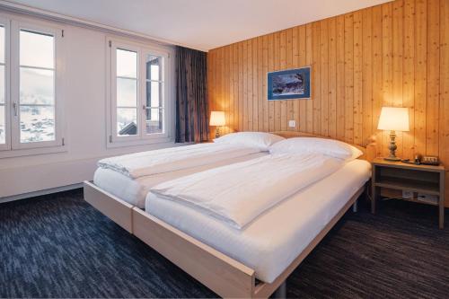 Double Room with Private Bathroom and Eiger View del hotel Jungfrau Lodge Swiss Mountain. Foto 2