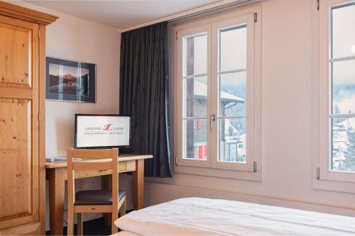 Double Room with Private Bathroom and Eiger View del hotel Jungfrau Lodge Swiss Mountain. Foto 4