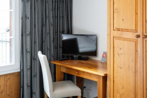 Double Room with Private Bathroom and Eiger View del hotel Jungfrau Lodge Swiss Mountain. Foto 5