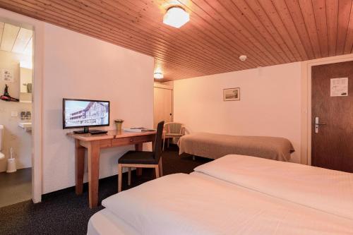 Habitación Triple con baño privado - Sin vistas del hotel Jungfrau Lodge Swiss Mountain. Foto 1