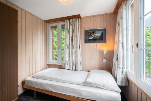 Triple Room with Private Bathroom and Eiger View del hotel Jungfrau Lodge Swiss Mountain. Foto 2