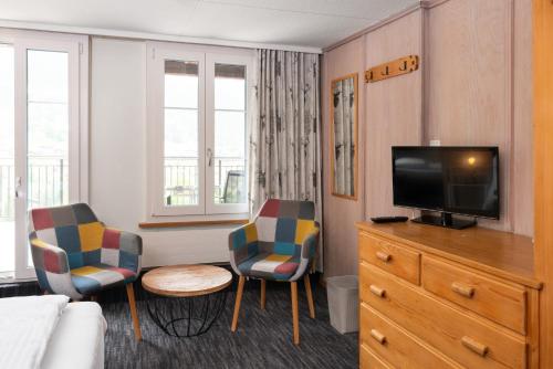 Triple Room with Private Bathroom and Eiger View del hotel Jungfrau Lodge Swiss Mountain. Foto 3