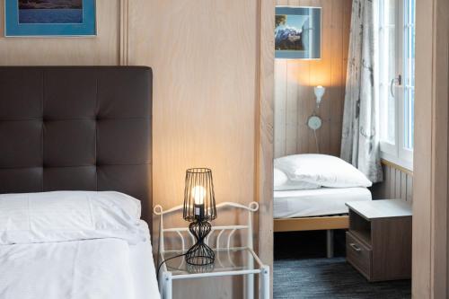 Triple Room with Private Bathroom and Eiger View del hotel Jungfrau Lodge Swiss Mountain. Foto 4