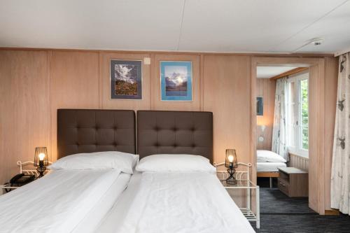 Triple Room with Private Bathroom and Eiger View del hotel Jungfrau Lodge Swiss Mountain. Foto 5